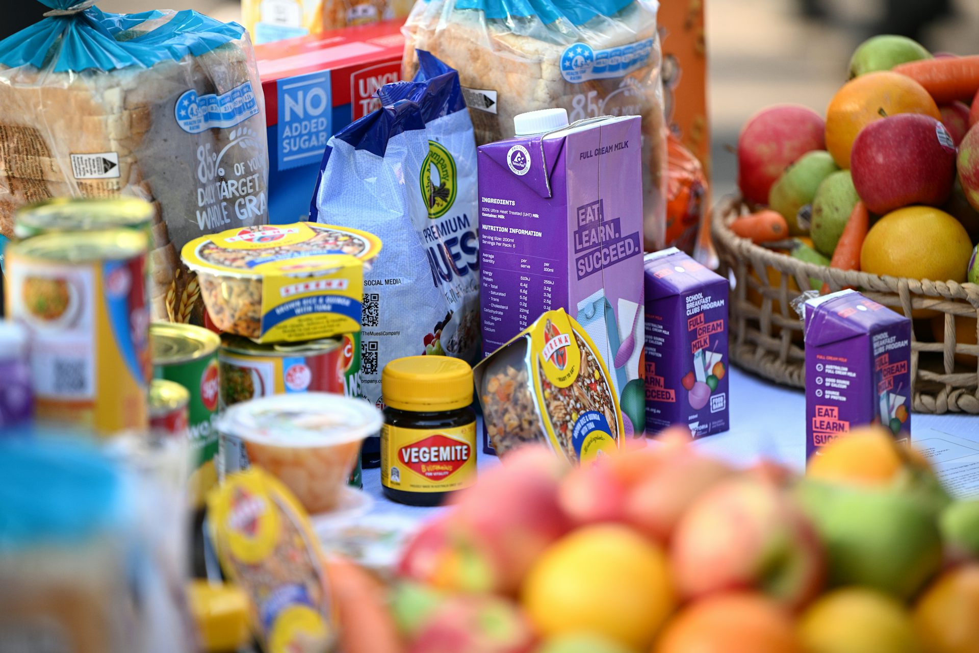 Bread, cans of food, cartons of milk and baskets of fruit.
