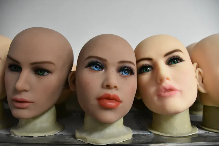 Photo of mannequin heads painted with makeup