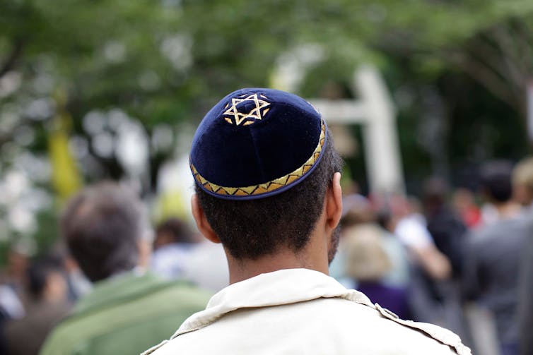 View from behind of a Jewish man in a kippah