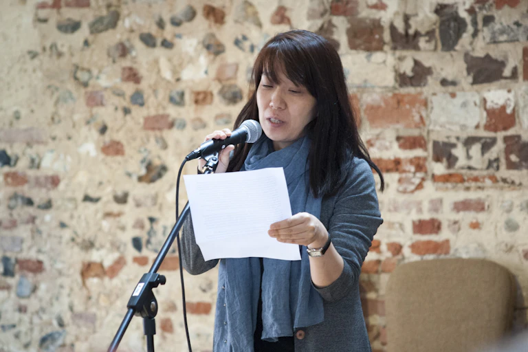 Han Kang reading on stage