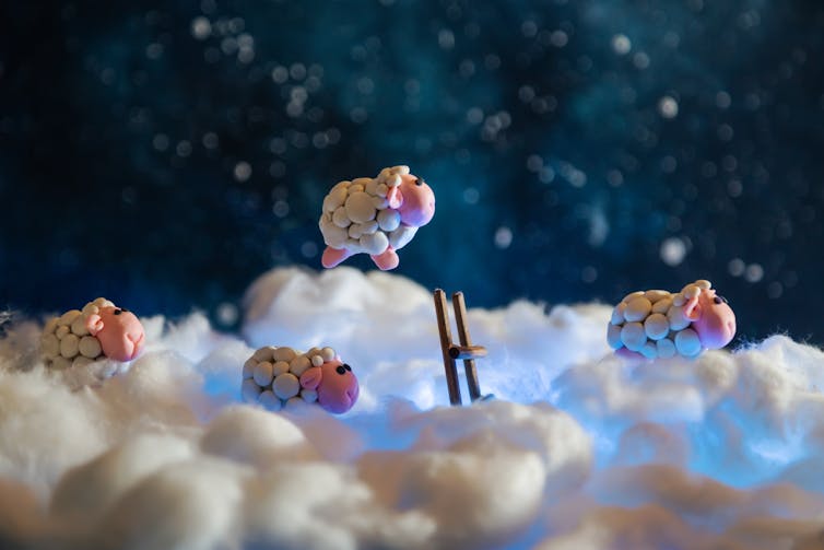 Plasticine sleep on clouds with ladder reaching through