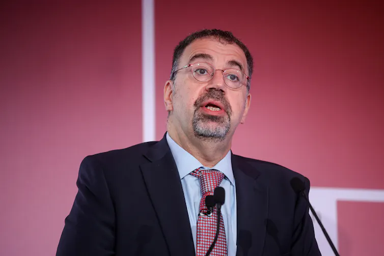 Daron Acemoglu speaking at a conference.