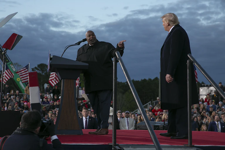 The Black lieutenant governor of North Carolina stands on stage and points to Donald Trump
