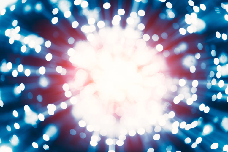 Close up of bright white, blurry explosion.