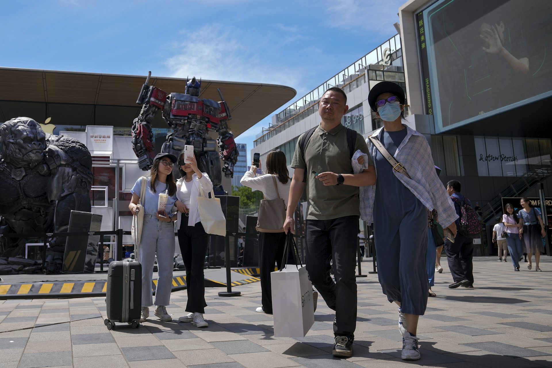 Shoppers walking in an outdoor mall in China