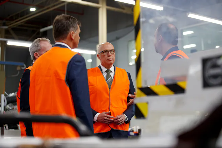 Peter Dutton visiting a bedding manufacturer.