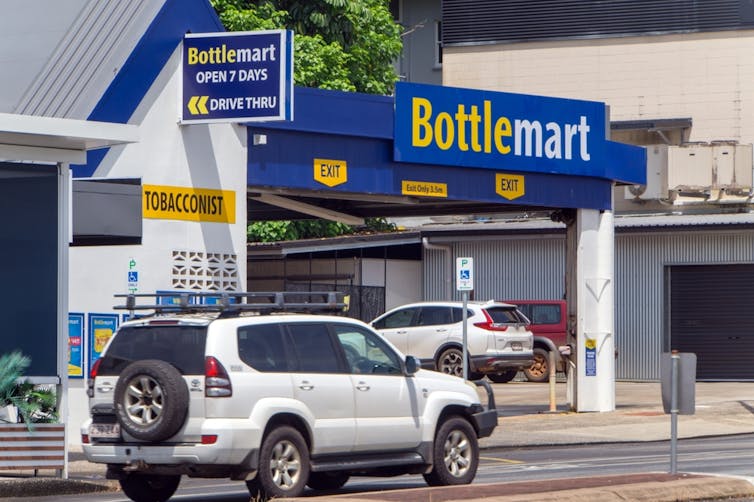 Car approaching drive-through bottle shop