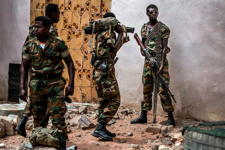 Heavily-armed soldiers on street patrol