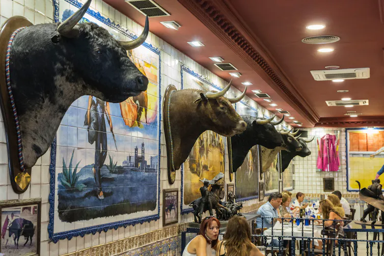 A Madrid restaurant with walls lined with the heads of bulls killed in bullfights.