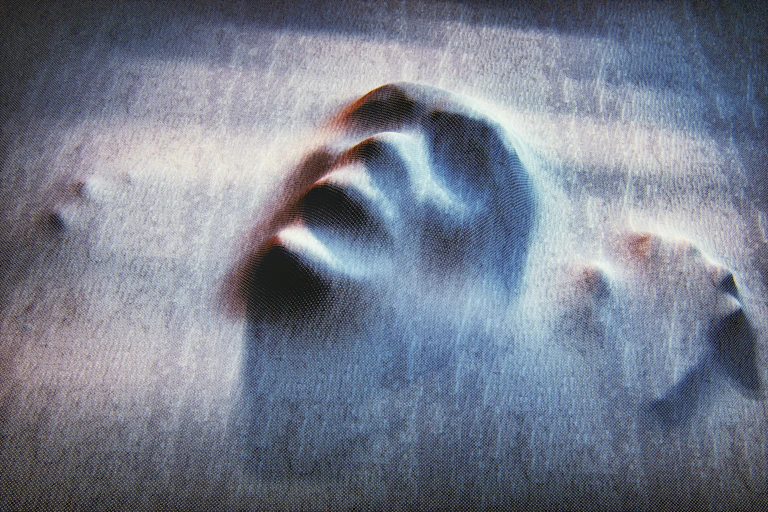 spooky face pressing up against a surface
