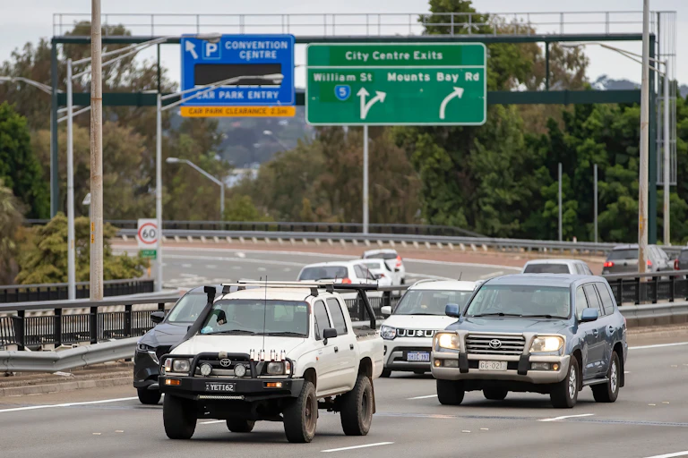A ute and an SUV in freeway traffic in Perth