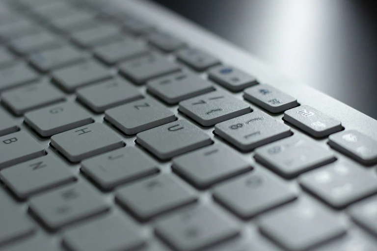 A close-up view of a letters and numbers on a keyboard.