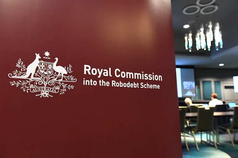 A wall saying Royal Commission into the Robodebt Scheme