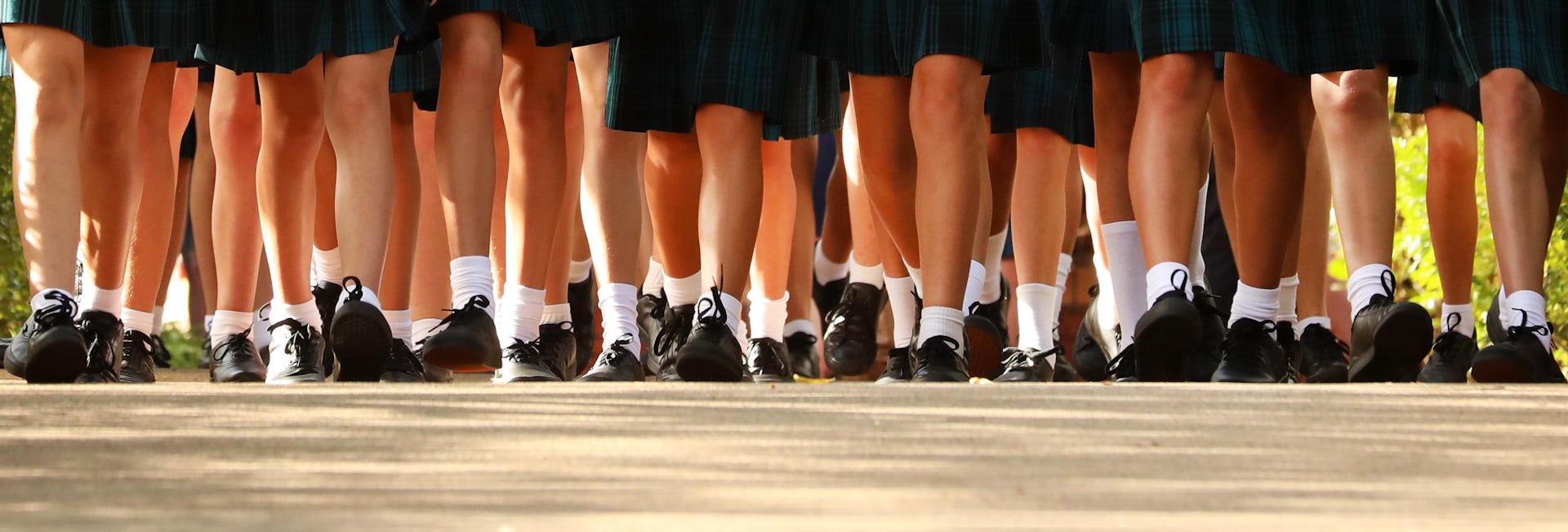 Why do some schools still force girls to wear skirts or dresses?