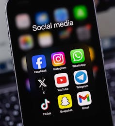 Phone screen showing icons of various social media apps.
