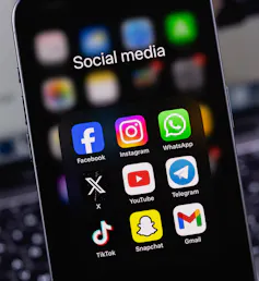 Phone screen showing icons of various social media apps.