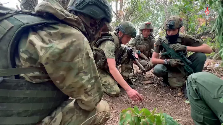 A group of young Russian soldiers in the field.