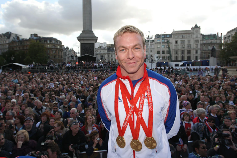 Sir Chris Hoy at Trafalgar Square in London wearing three gold medals.