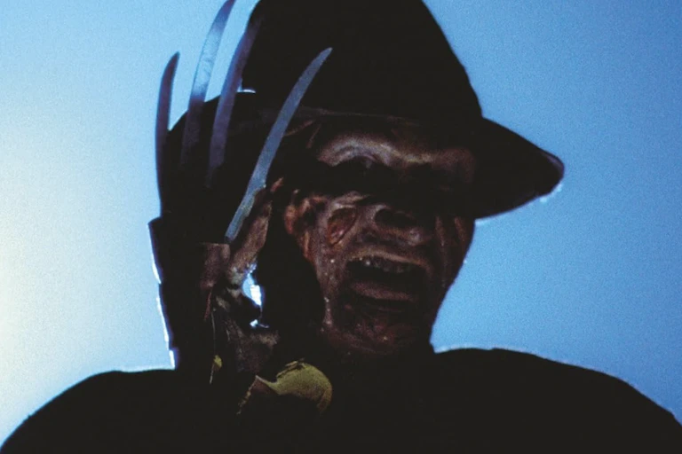 scary character in hat with knives for fingers