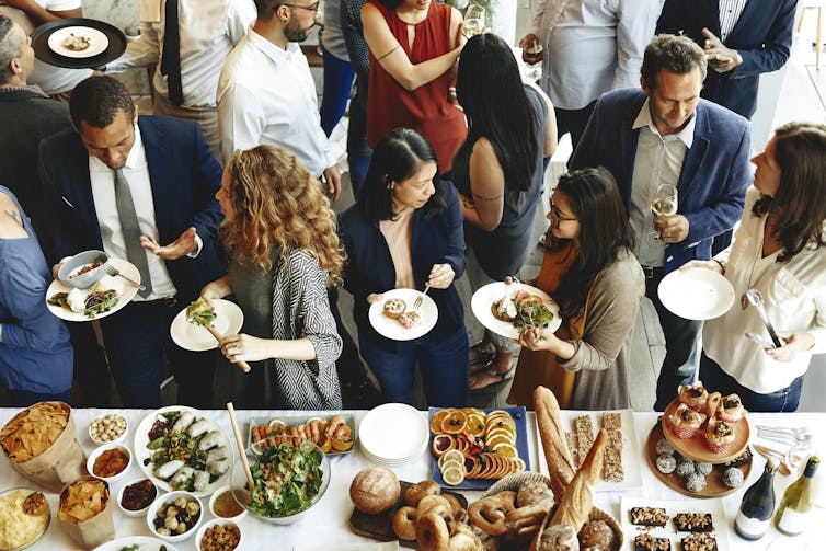 people are event share food and conversation