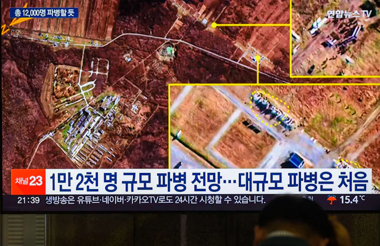 Satllite images taken from South Korean TV showing multiple images believed to be of North Korean troops in Russia.