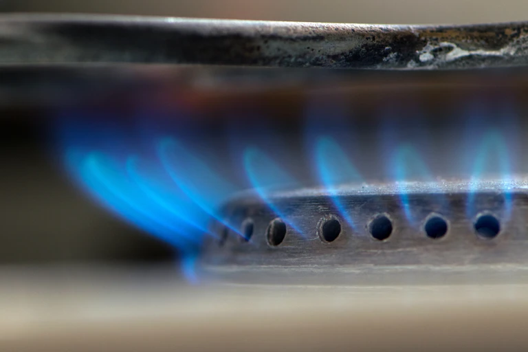 Close-up image of a lit gas hob.