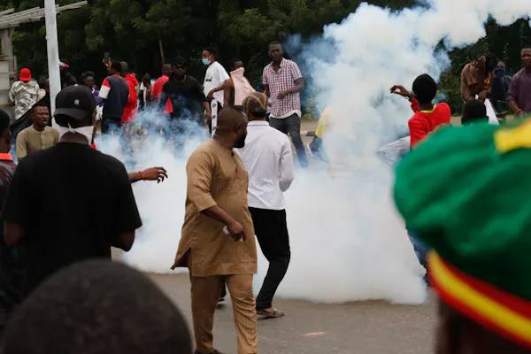 Police and soldiers intervene with tear gas to disperse the crowd gathered at Eagle Square, protesting against the rising cost of living following the removal of gasoline subsidies in Abuja,