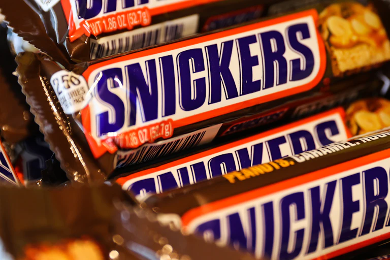 A stack of full-size Snickers bars