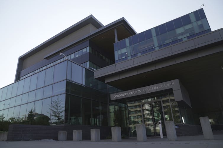 External view of the entrance to a glass-fronted building