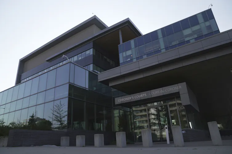 External view of the entrance to a glass-fronted building
