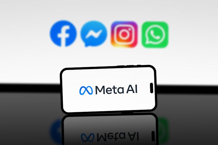 Meta AI logo on smartphone with Meta apps in background.