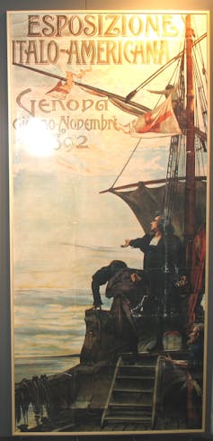 A poster with ornate lettering shows a man in black clothing grandly gesturing at the sun from the deck of a boat.