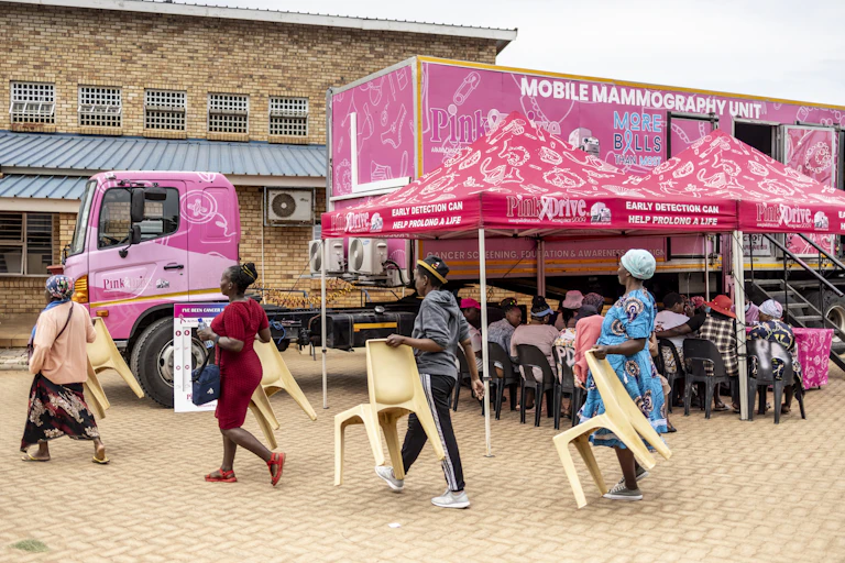 Patients and chairs during breast cancer screening drive