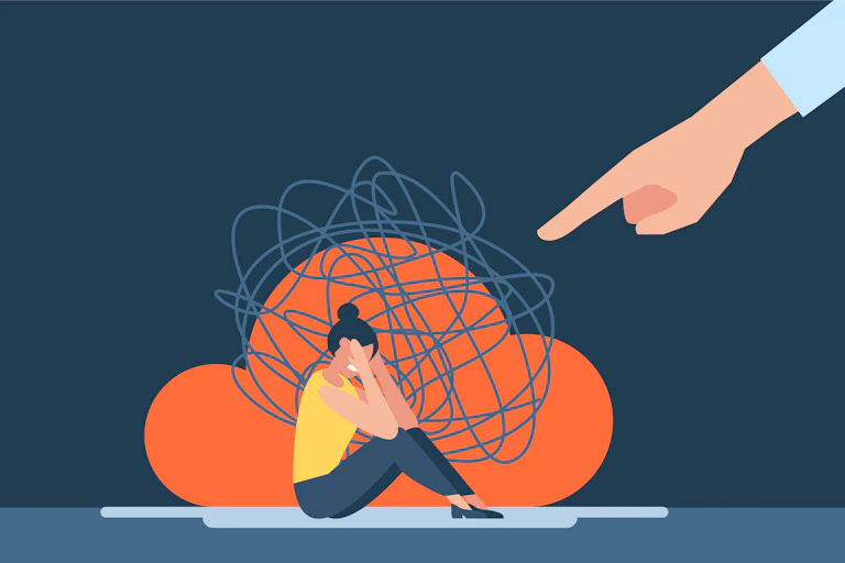 Illustration of worker huddled in seated position after bullying at work