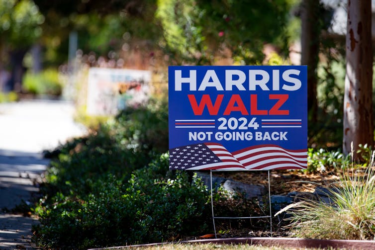 A small sign reading Harris Walz 2024, not going back.