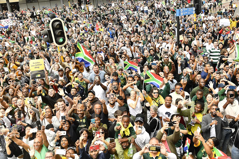 Thousands of fans line the streets during the South Africa men's national rugby team trophy tour on November in Cape Town