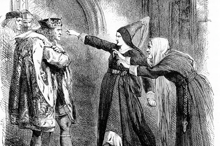 Two women point their fingers at thenKing as they stand in front of him.