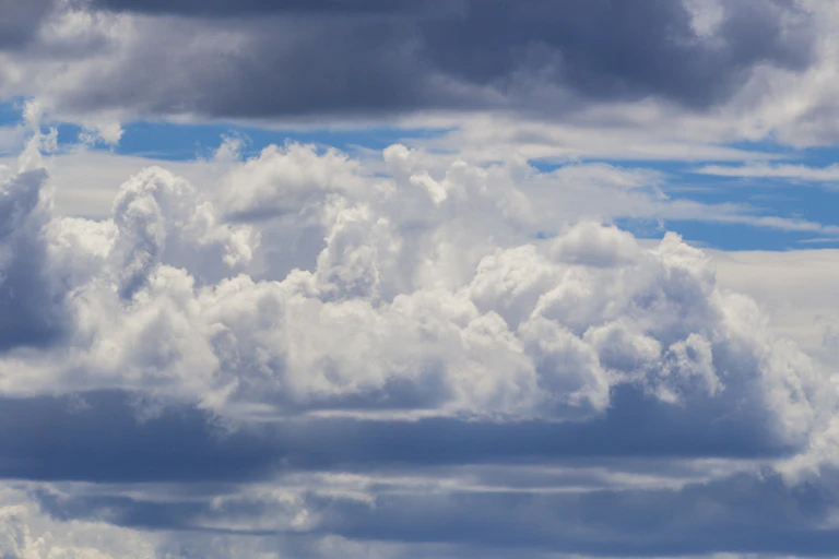 Vief of the sky filled with towering puffy clouds