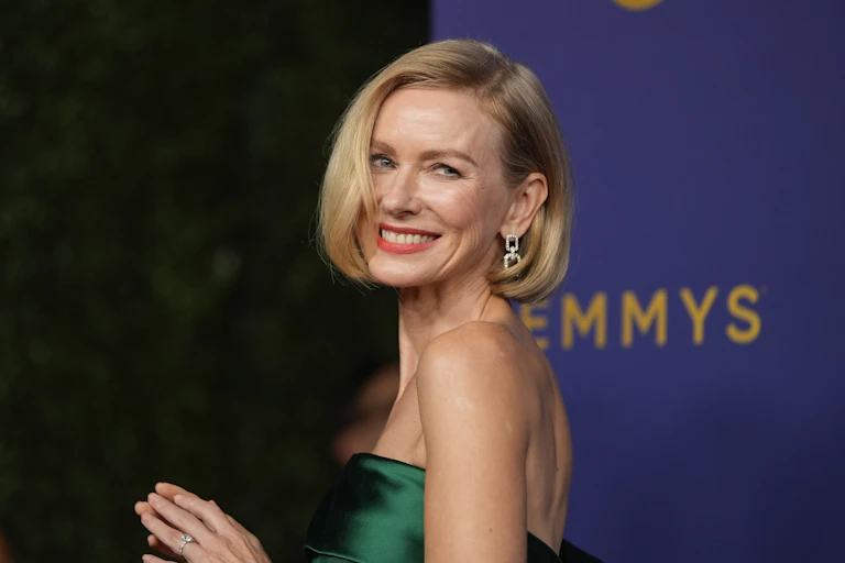 blonde woman smiles on red carpet