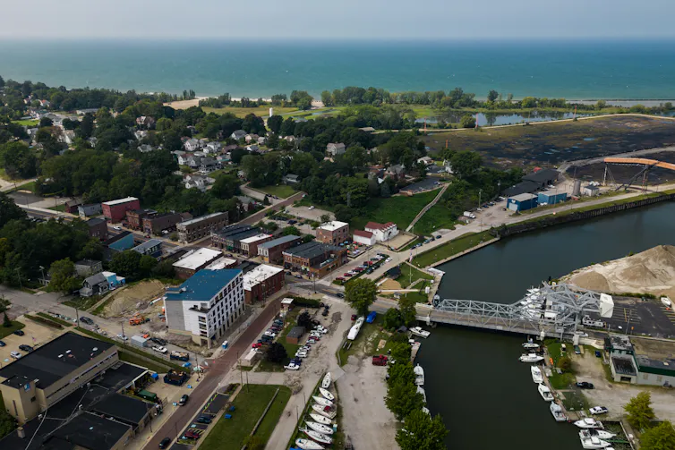 Aerial shot of a small town on a river with Great Lake views
