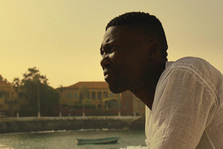 A man looking out over a harbour