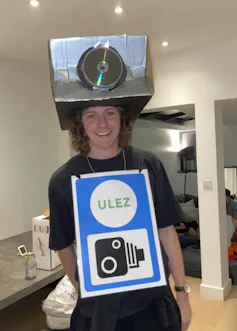 A young man dressed as a ULEZ camera for Halloween