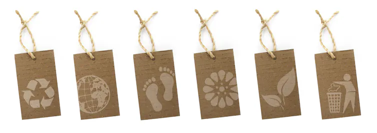 white background, six brown labels with eco images on eg footprint, recycling triangle, flower