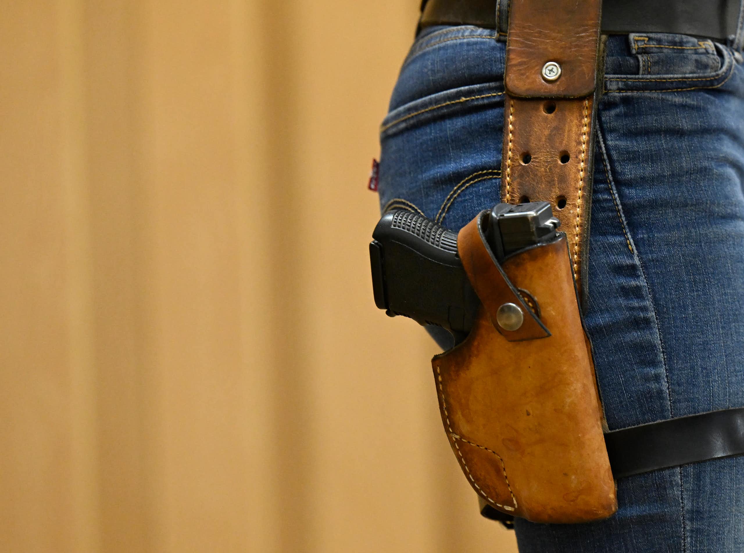 holstered gun on woman's hip