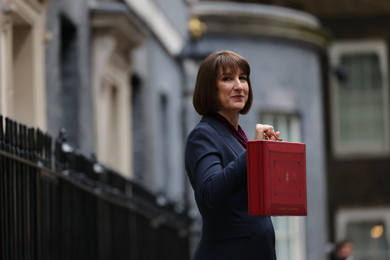 Rachel Reeves holding her ministerial red box outside 11 Downing Street.