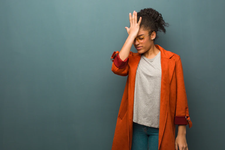 Woman slapping her head