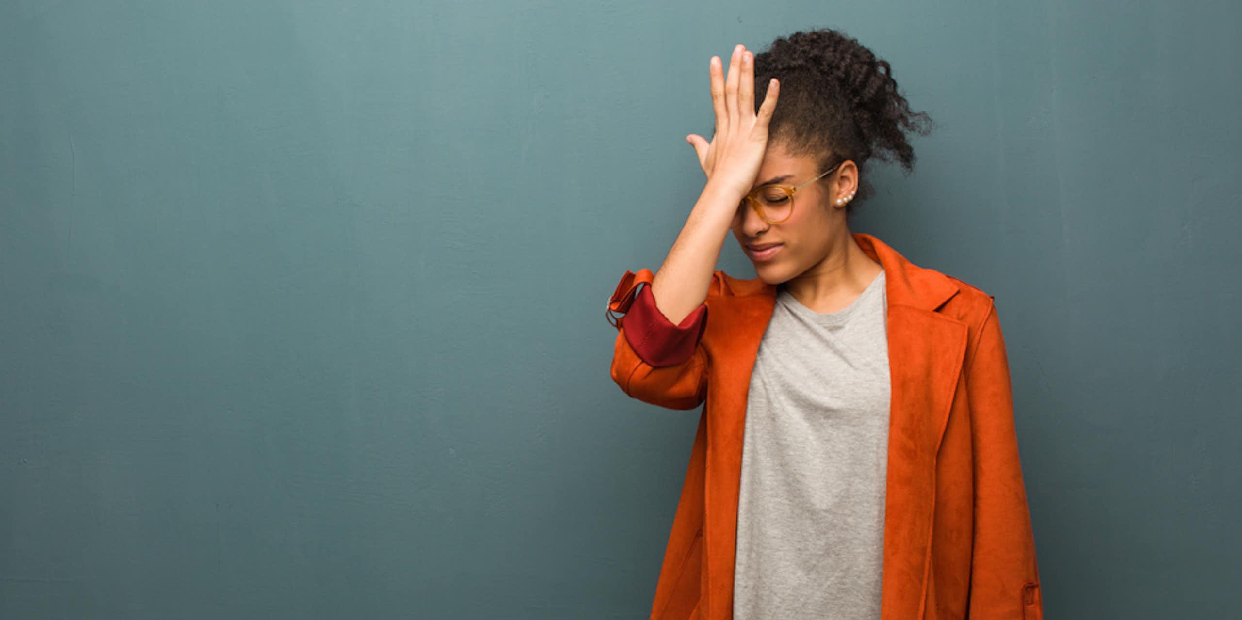 Woman slapping her head