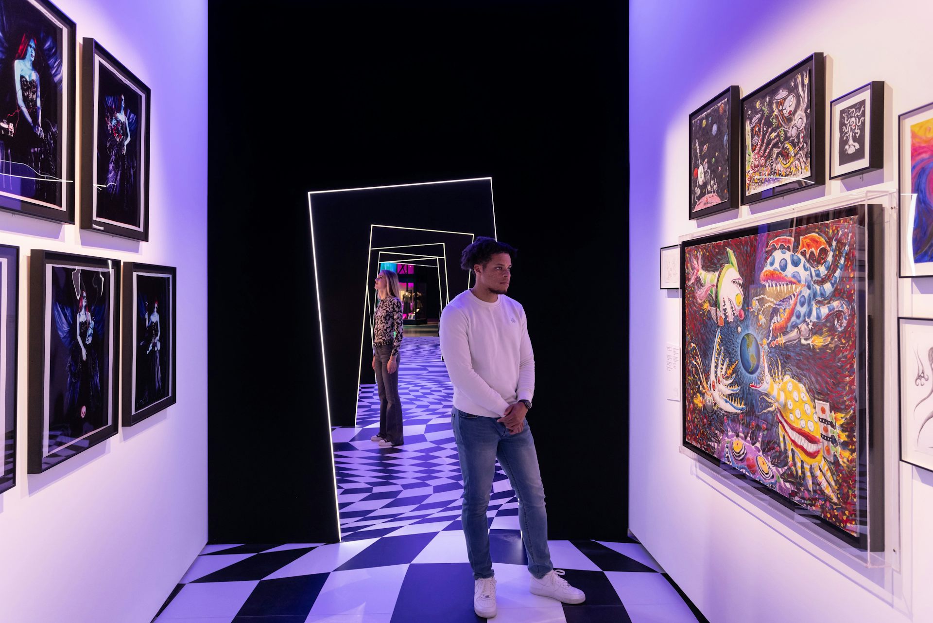 Man looking at the Tim Burton exhibition.