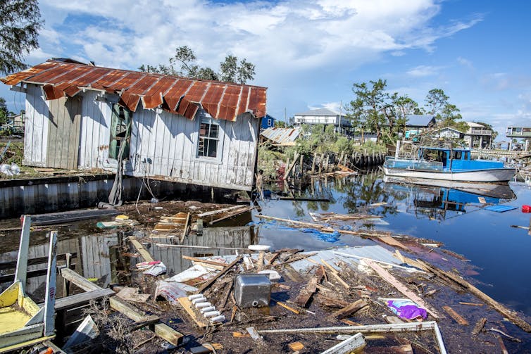 Damaged buildings in a coastal area in the aftermath of a hurricane.