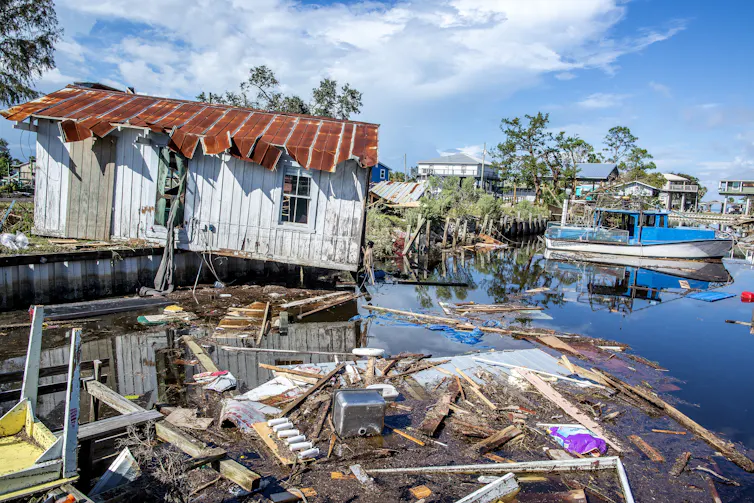 Damaged buildings in a coastal area in the aftermath of a hurricane.